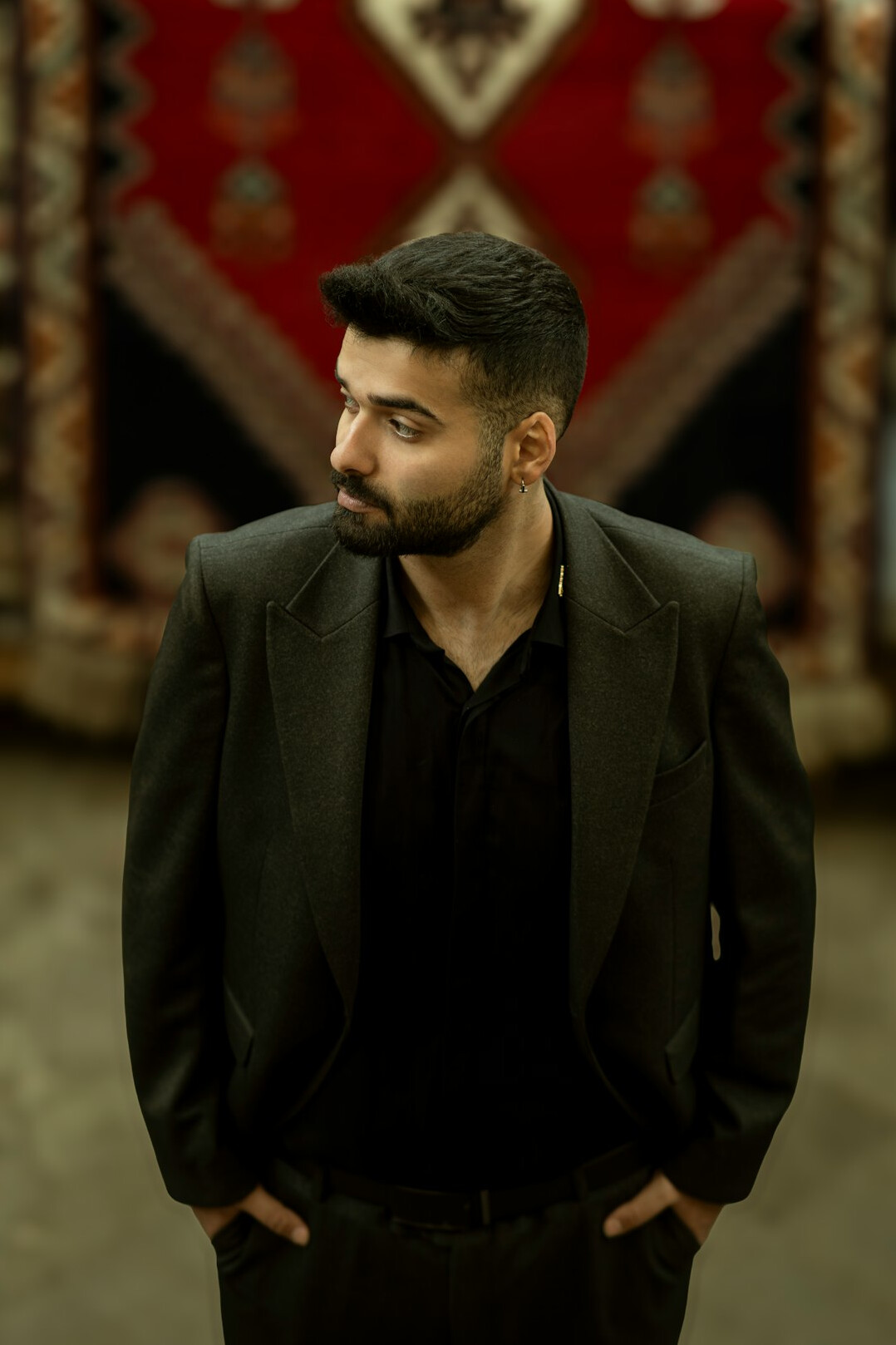 Portrait of a man in a suit with a short beard